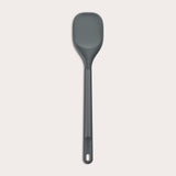 #large A Zyliss Spoontula with a dark gray, rounded silicone head and a long ergonomic handle, featuring a small hanging hole near the end, is displayed against a light background. #Large