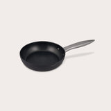 The Zyliss Ultimate Pro Non-Stick Frying Pan With Pouring Lip features a black, Swiss-coated hard-anodized aluminum body and a long gray handle, shown on a plain white background. #20cm/8"