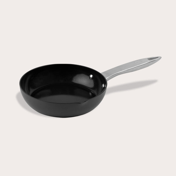 The Zyliss Ultimate Pro Ceramic Fry Pan, featuring a black non-stick coating and a silver metal handle, is displayed against a plain light background. #20cm/8"