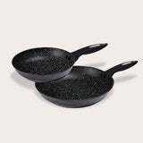 Two Zyliss Ultimate Non-Stick Frying Pans, each with a black handle and Swiss non-stick coating with white speckles, are stacked on a light background. The pans are different sizes. #20cm/8"&28cm/11"