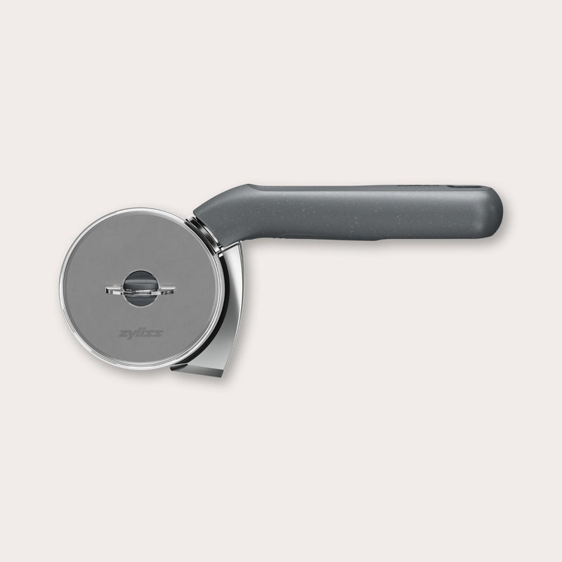 A stainless steel and black-handled pizza cutter, featuring a circular blade and ergonomic grip, is shown against a plain light background.