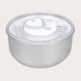 The Zyliss Easy Spin 2 Stainless Steel Salad Spinner features a clear, airtight lid with a white and gray vent, a non-slip base for stability, and a secure lid attachment for easy salad preparation.