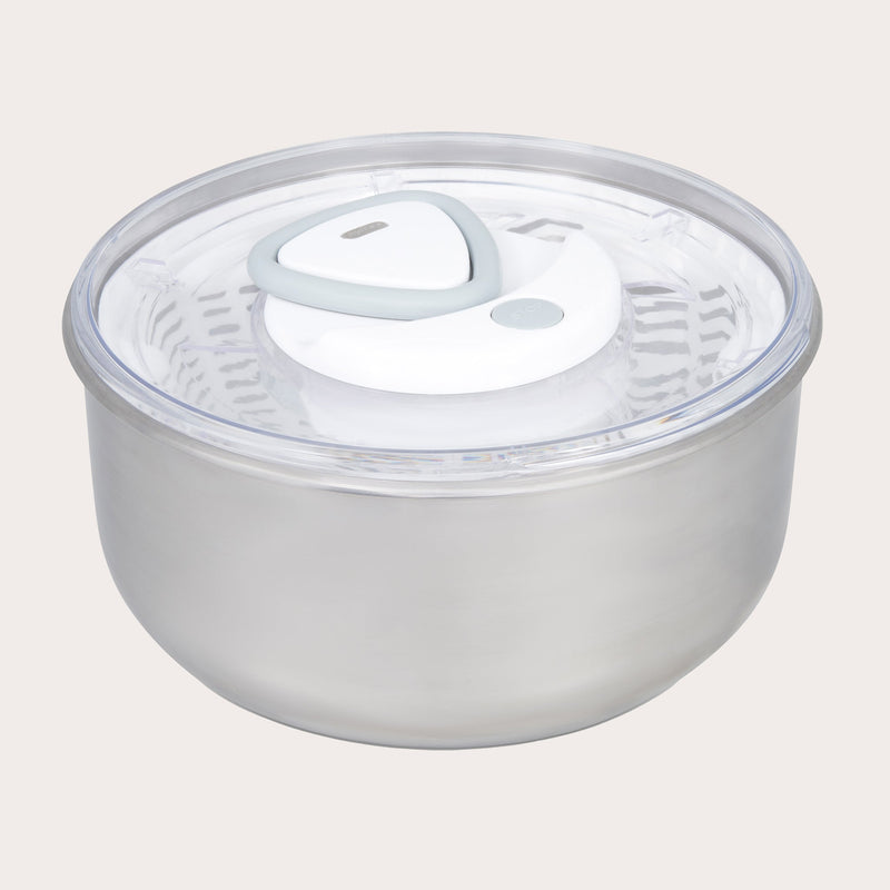 The Zyliss Easy Spin 2 Stainless Steel Salad Spinner features a clear, airtight lid with a white and gray vent, a non-slip base for stability, and a secure lid attachment for easy salad preparation.