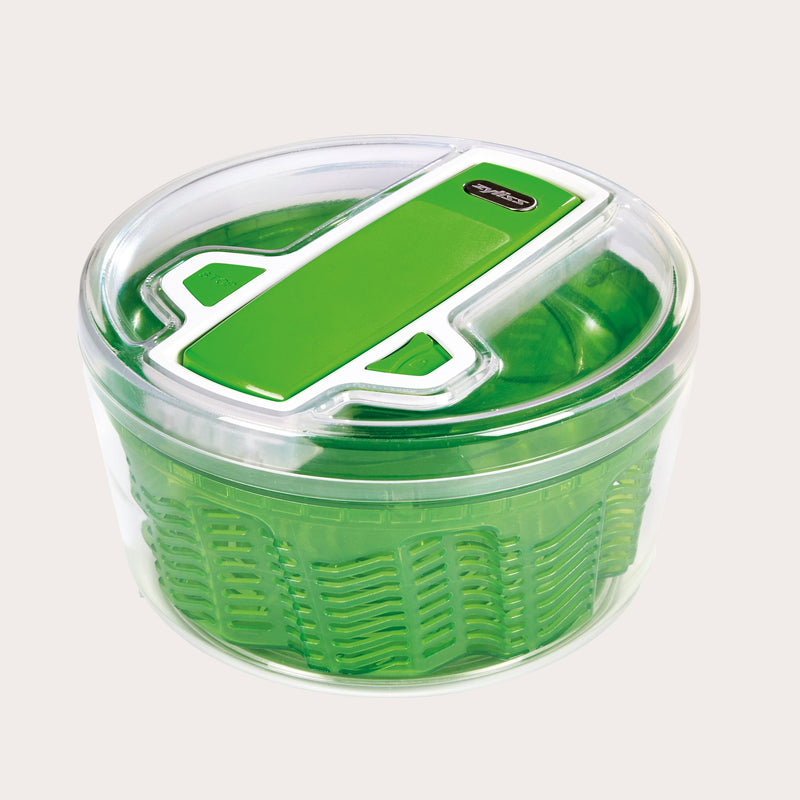 The Zyliss Swift Dry Salad Spinner Large features AquaVent™ technology, a green inner basket, matching green and white lid, and a non-slip base for efficient washing and drying of salad greens.